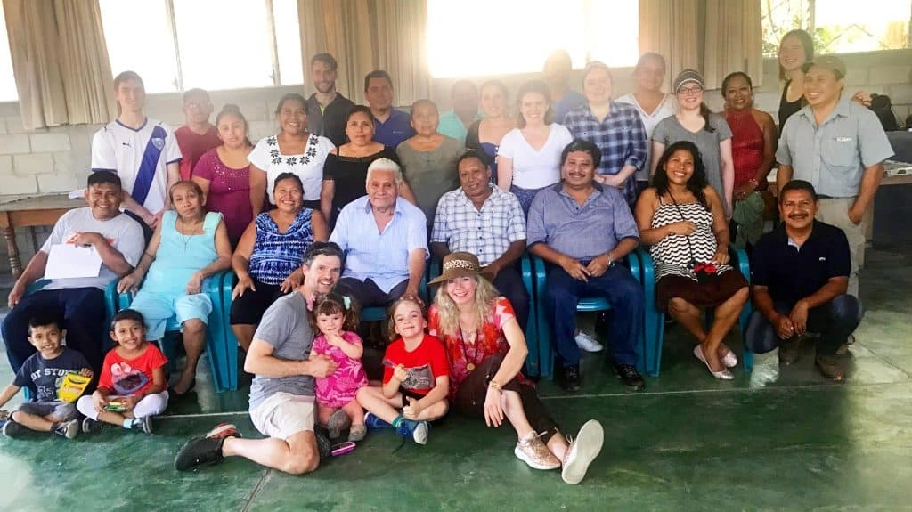 Hands holding a plant sprout